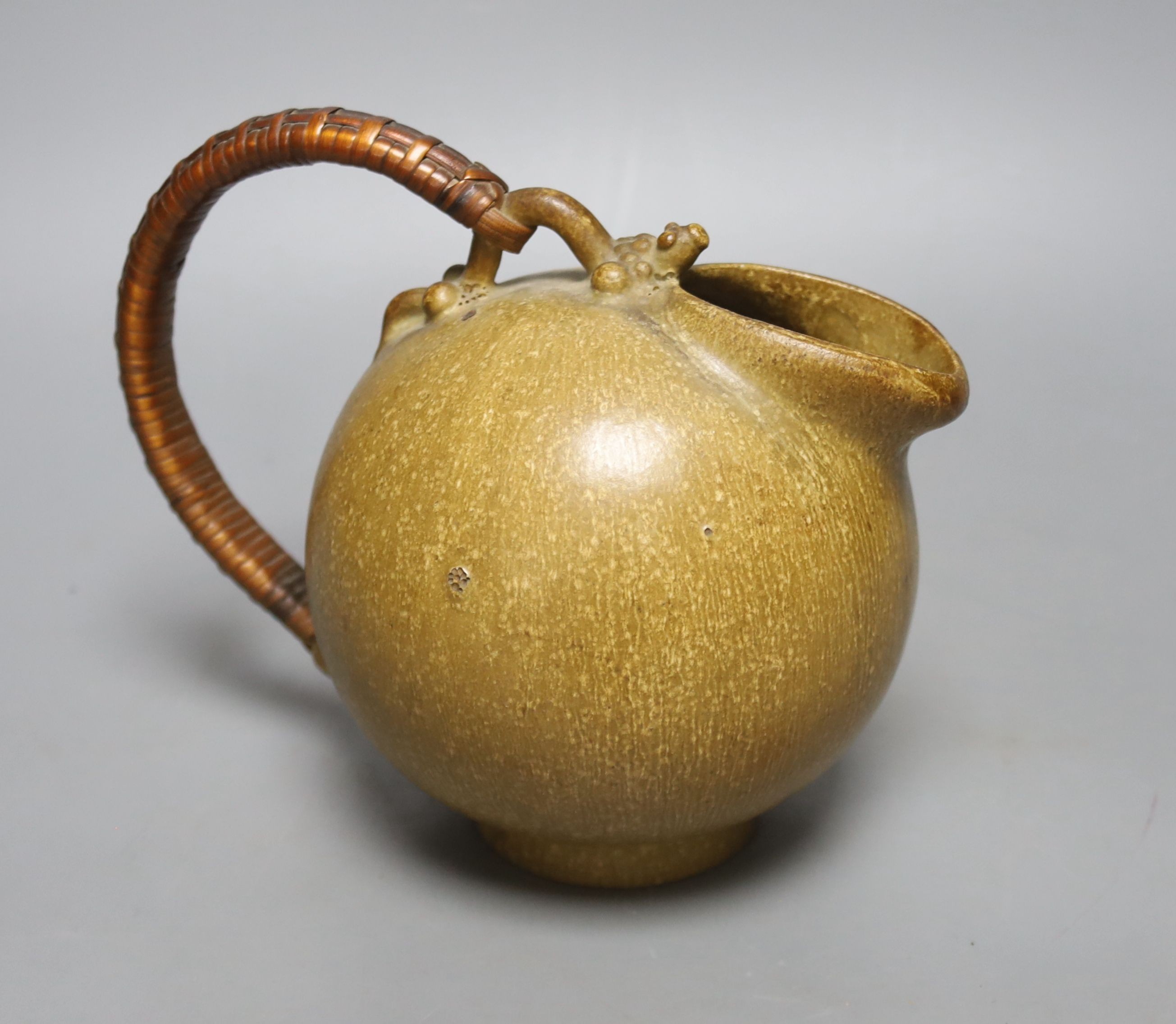 Art Pottery ewer, initials AM, numbered 151 on base, 19 cms wide, including handle.